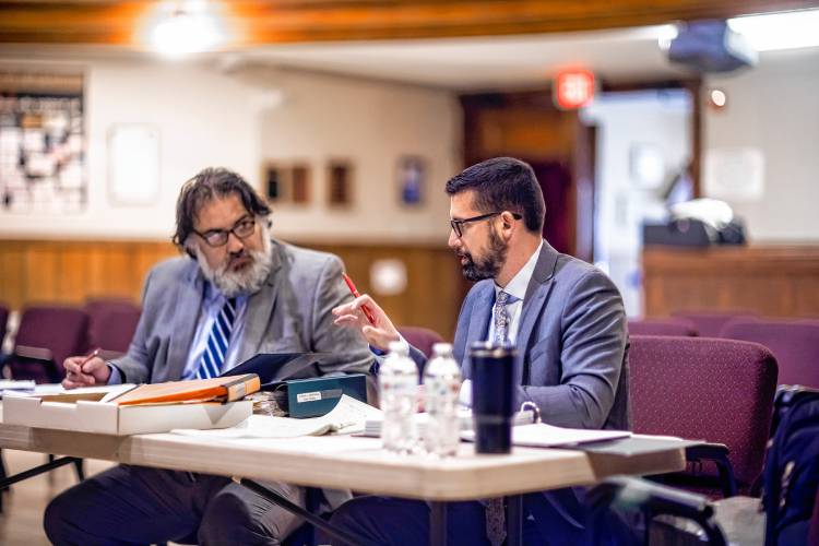 Lawyer Peter Perroni (left) confers with Jacob Drouin, a former Franklin police officer and union president during the cityâs personnel advisory board hearing at the Franlin City Hall on Tuesday, October 31, 2023.