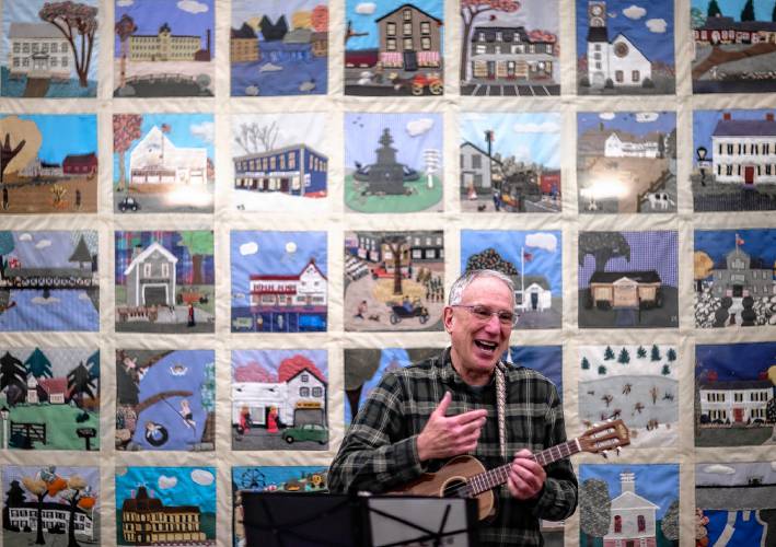 Ric Waldman leads the Ukulele group at the Hopkinton community room at the town library on Tuesday, February 20. The group meets once a month to play and sing.