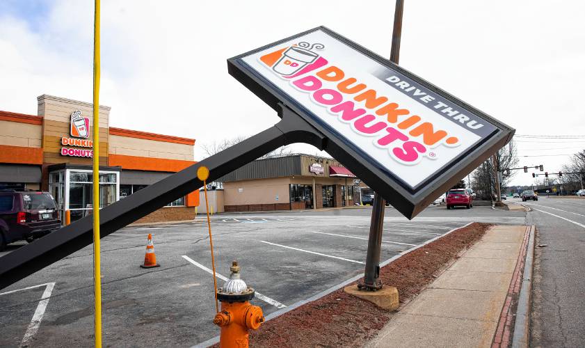 The outdoor sign for the Dunkin’ store on South Main Street in Concord fell over after the high winds hit on Thursday, Feb. 29, 2024.