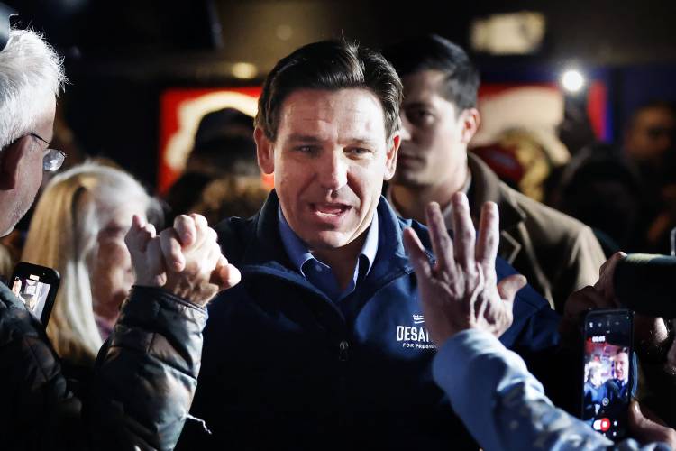 Republican presidential candidate Florida Gov. Ron DeSantis arrives for a campaign event at Wally's bar, Wednesday, Jan. 17, 2024, in Hampton, N.H. (AP Photo/Michael Dwyer)