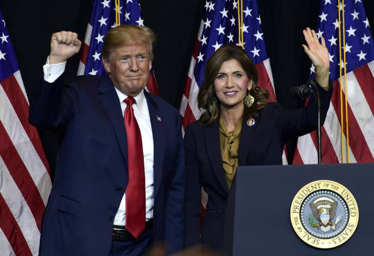 FILE - President Donald Trump appears with South Dakota Gov. Kristi Noem, Sept. 7, 2018, in Sioux Falls, S.D. While vice presidential candidates typically aren't tapped until after a candidate has locked down the nomination, Trump's decisive win in the Iowa caucuses and the departure of Florida Gov. Ron DeSantis from the race has only heightened what had already been a widespread sense of inevitability. Noem is considered a close ally of the former president who is among those...