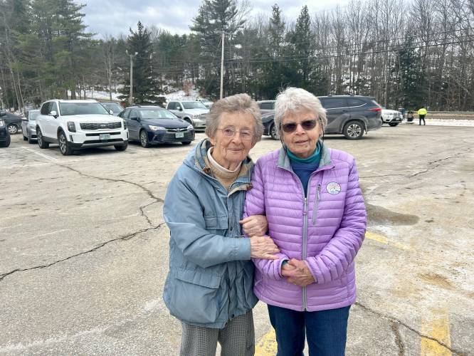 Bow residents Judith Doucet, 88, and Nancy Haigh, 89, outside the Bow Community Building on Tuesday morning.