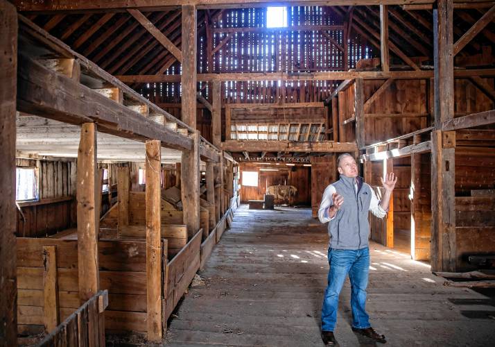 Cedar Mill Group project manager Nick Colarusso on the first floor of the red barn the company purchased on Tuesday, April 9, 2024. The fact the barn had a solid roof that kept the rain out of the structure, the barn is solid shape.