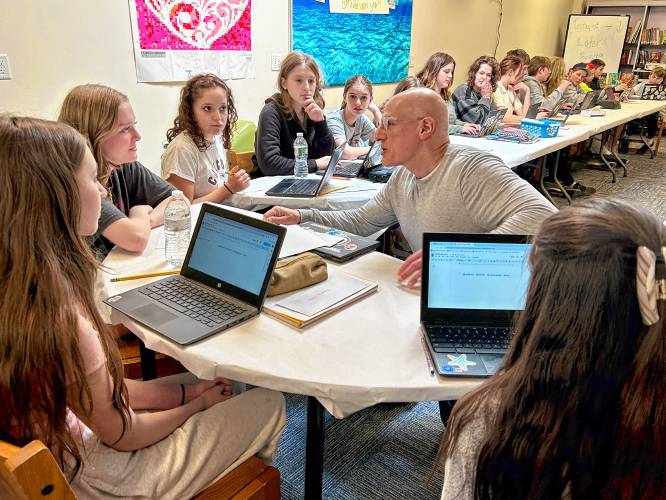 Young adult author Gordon Korman leads an adventure writing workshop with Bow Memorial School students on Tuesday, April 16.