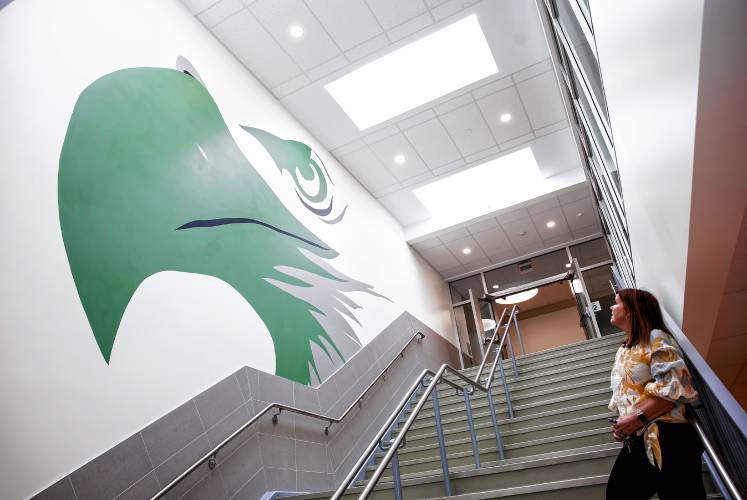 Allenstown principal Shannon Kruger greets looks up at the painting of the school mascot on Thursday morning, April 18, 2024. A group of students came to the Allenstown Community School for a greeting and a tour of the new facility.