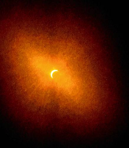 Douglas Laperle took this photo of the eclipse on his iPhone by putting the eclipse protective glasses over the lens.