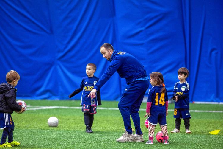 Bosnian youth coach Muhamed Durakovic instructs his team at the AutoFair SportsDome in Goffstown on Thursday. Some young players in the Bow and Concord area have started playing in Goffstown.