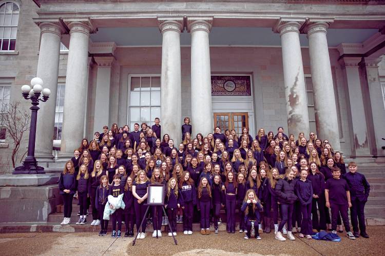 The Weare Middle School choir stand in front of the State House steps for a photograph on Wednesday, March 27, 2024. Governor Chris Sununu signed a proclamation for celebration of Music in our Schools Month. Area schools rotated and sang and played in front of the steps.