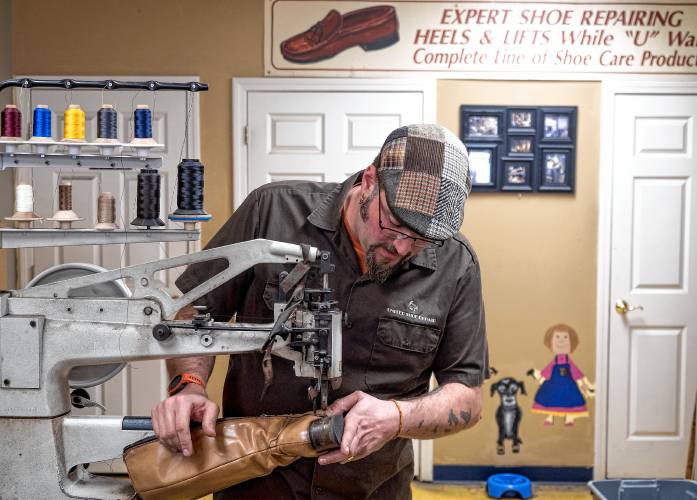D.J. Annicchiarico, owner and part of fourth-generation cobblers at United Shoe Repair, has a small shop in  Concord.