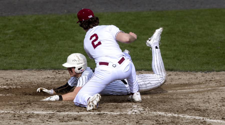 Concord pitcher Noah Chrabolowski tries to tag Manchester Central/West runner Tyler Marcoux on Monday, April 15, 2024. Concord lost in extra innings, 15-10.