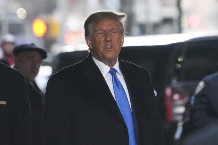 Former President Donald Trump leaves his apartment building in New York, Monday, Jan. 22, 2024. (AP Photo/Seth Wenig)