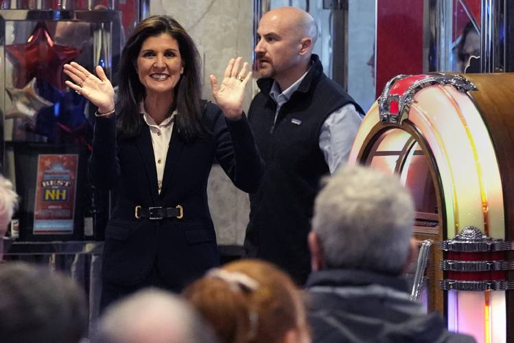 Republican presidential candidate former UN Ambassador Nikki Haley waves to guests during a campaign stop at Mary Ann's Diner, Friday, Jan. 19, 2024, in Amherst, N.H. (AP Photo/Charles Krupa) 