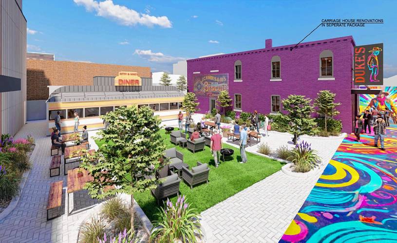 Renderings from a new proposal for the Arts Alley development show the reduced size of its building on South Main Street — down to two floors with a roof deck — and the addition of a restored antique, galley-style diner to its footprint. 