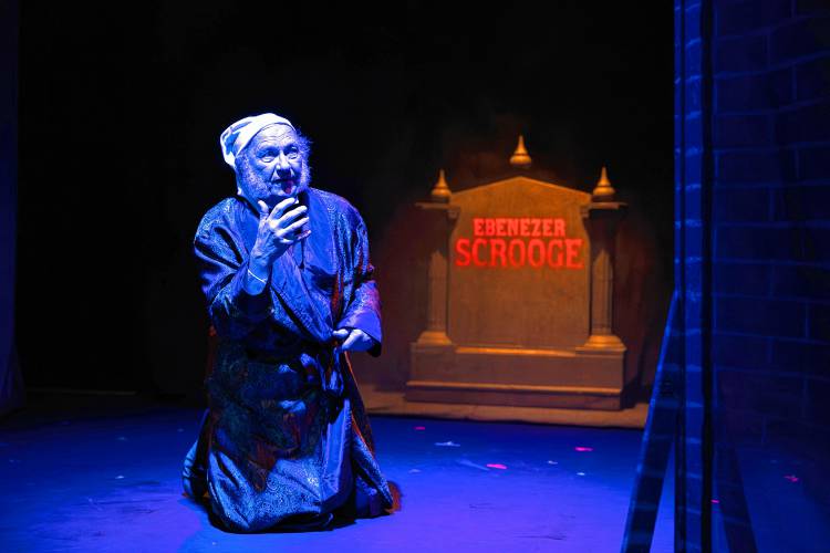 Erik Hodges plays Scrooge in front of an audience of about 100 at the intimate Hatbox Theatre at the Steeplegate Mall on Wednesday. The Hatbox will hold its final show on Dec. 29.