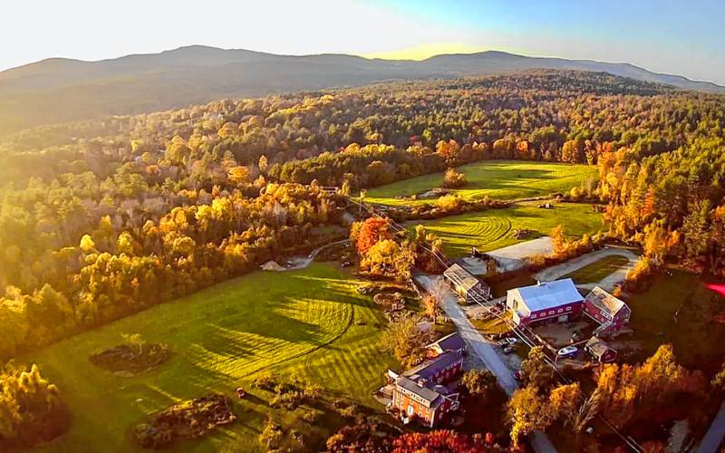 A drone shot of Curtis Farm in Wilton, with western views toward the Wapack Range, left, and Grand Monadnock in the distance. 