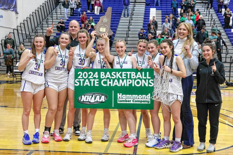 Concord Christian celebrates winning the 2024 Division II girls’ basketball championship at the University of New Hampshire on Sunday.