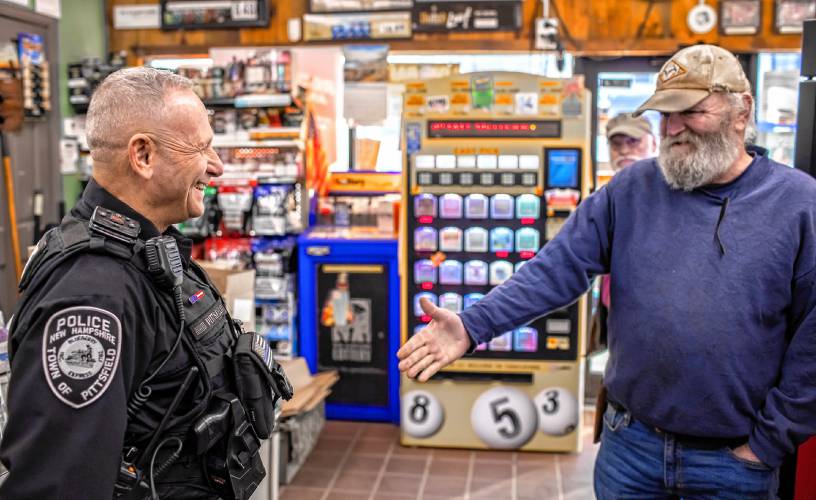 Pittsfield police officer Don Bolduc greets James Wesson at the Bell Brothers convenience store in downtown on Thursday, February 8, 2024. Wesson remembered that Bolduc passed on giving him a ticket in the past when Wesson said he couldnât afford to pay the fine.