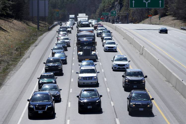 Eclipse seekers and drivers head north on Route 93 in heavy traffic hours before an afternoon total solar eclipse, Monday, April 8, 2024, in Hooksett, N.H. (AP Photo/Charles Krupa)