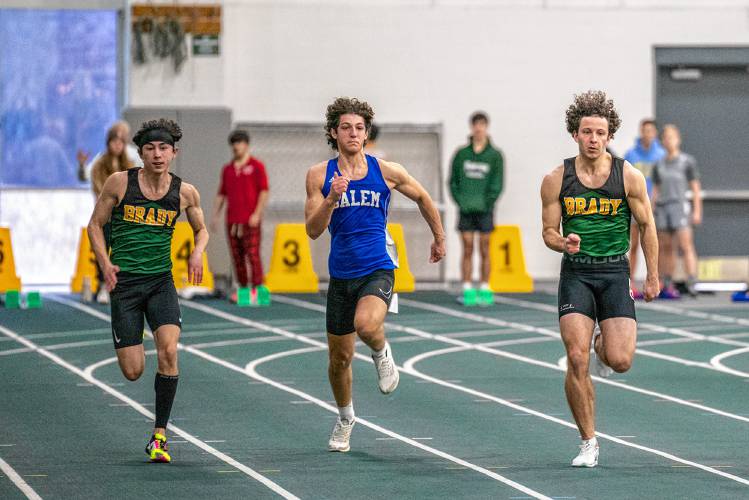 Bishop Brady’s Alan Yap (left) and Josh Gentchos (right) sprint to the finish line in the finals of the 55-meter dash at an indoor track meet at Plymouth State University on Saturday. Gentchos won in 6.74 seconds, while Yap finished third. 