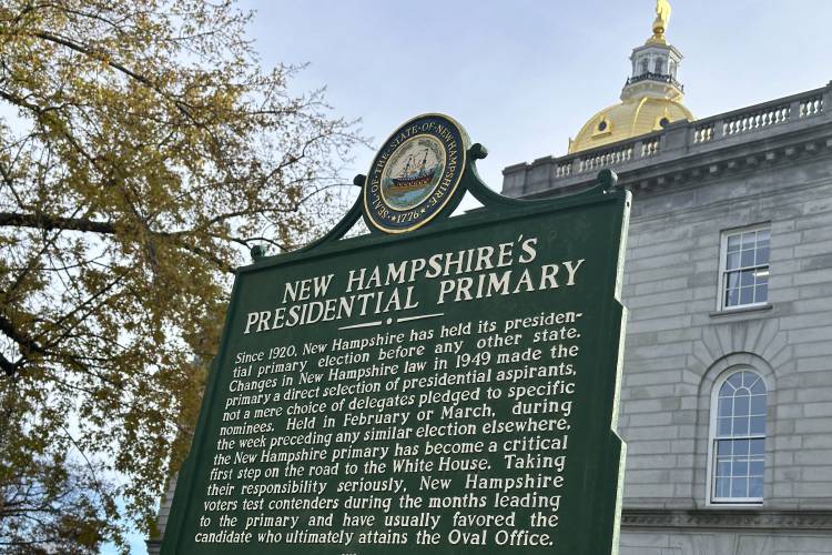 FILE - A marker stands outside the Statehouse in Concord, N.H., Nov. 15, 2023, describing the history of the state's first-in-the-nation presidential primary. New Hampshire's attorney general Monday, Jan. 8, 2024, ordered national Democratic party leaders to stop calling the state’s unsanctioned presidential primary “meaningless,” saying do so violates state law. (AP Photo/Holly Ramer, File)