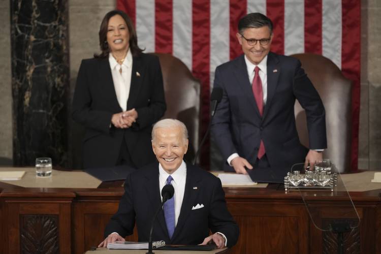 President Joe Biden delivers the State of the Union address to a joint session of Congress at the U.S. Capitol, Thursday March 7, 2024, in Washington, as Vice President Kamala Harris and House Speaker Mike Johnson of La., watch. (AP Photo/Andrew Harnik)