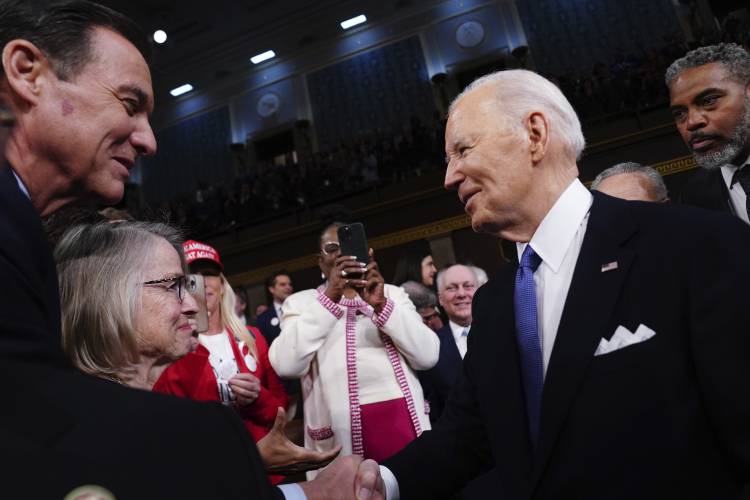 President Joe Biden, right, arrives to deliver the State of the Union address to a joint session of Congress at the Capitol, Thursday, March 7, 2024, in Washington. (Shawn Thew/Pool via AP)
