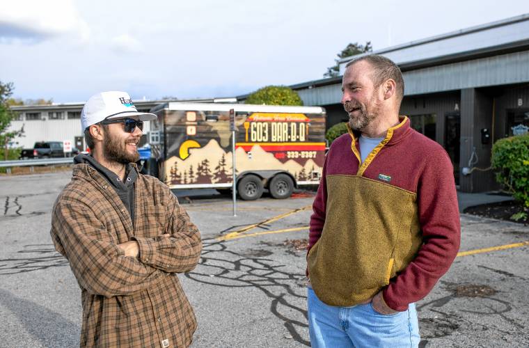 Concord native Ben Normandeau, left, of 603 Bar-B-Q, a barbecue catering operation, and new owner Erin Inman outside of Lithermans Limited off of Hall Street in Concord on Thursday.