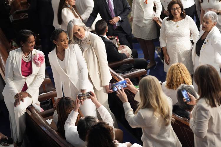 Democratic members of Congress, wearing white to support reproductive rights, pose for a photo before President Joe Biden delivers the State of the Union address to a joint session of Congress at the U.S. Capitol, Thursday March 7, 2024, in Washington. (AP Photo/Andrew Harnik)