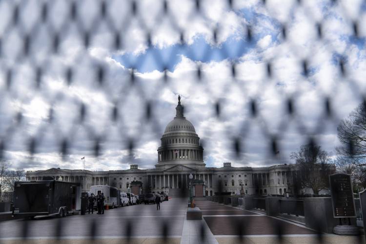The U.S. Capitol is seen behind a security fence on Thursday, March 7, 2024, in Washington, ahead of President Biden's State of the Union address on Thursday night. (AP Photo/Jose Luis Magana)