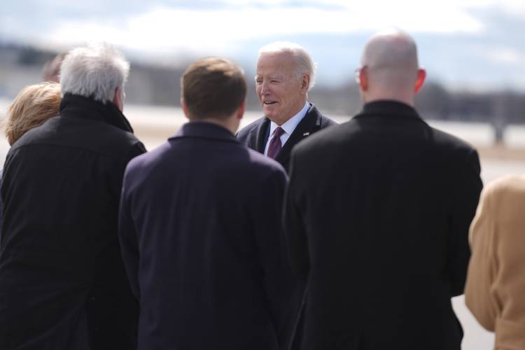 President Joe Biden is greeted as he arrives at Manchester-Boston Regional Airport for an event on lowering prices for American families, Monday, March 11, 2024, in Manchester, N.H. (AP Photo/Evan Vucci)