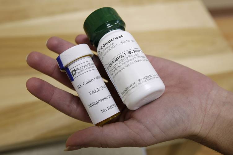 FILE - Bottles of abortion pills mifepristone, left, and misoprostol, right, are shown, Sept. 22, 2010, at a clinic in Des Moines, Iowa. 