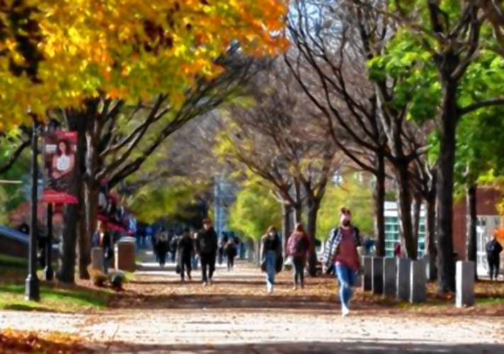 Keene State College students walk down Appian Way between classes on a fall day in 2021.