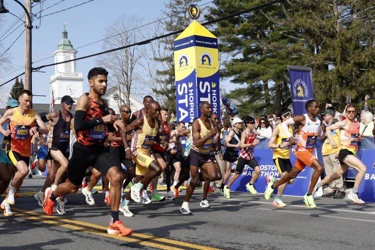 Elite male runners break from the start line of the Boston Marathon, Monday, April 15, 2024, in Hopkinton, Mass. (AP Photo/Mary Schwalm)