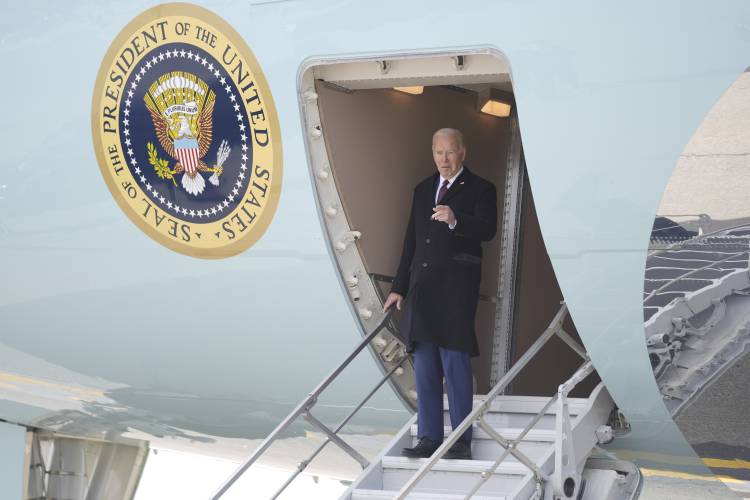 President Joe Biden arrives at Manchester-Boston Regional Airport for an event on lowering prices for American families, Monday, March 11, 2024, in Manchester, N.H. (AP Photo/Evan Vucci)