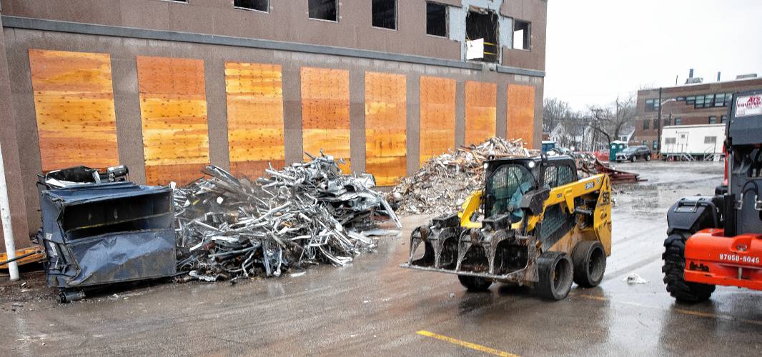 The demolition of the former Department of Justice building on North State Street is proceeding with piles of materials gathered outside the structure on Capitol Street side on Thursday, March 7, 2024.