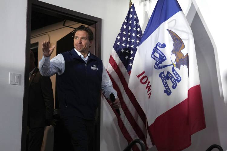 FILE - Republican presidential candidate Florida Gov. Ron DeSantis arrives at a meet and greet, July 27, 2023, in Chariton, Iowa. DeSantis has suspended his Republican presidential campaign after a disappointing showing in Iowa's leadoff caucuses. He ended his White House bid Sunday, Jan. 21, 2024, after failing to meet lofty expectations that he would seriously challenge former President Donald Trump. (AP Photo/Charlie Neibergall, File)