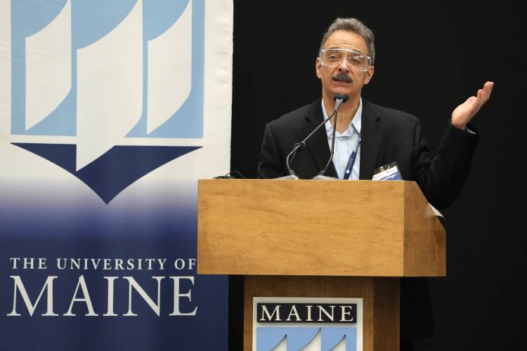 Habib Dasher, director of UMaine's Advanced Structures & Composite Center, speaks at the unveiling of the world's largest 3D printer, Tuesday, April 23, 2024, at the University of Maine, in Orono, Maine. (AP Photo/Robert F. Bukaty) 