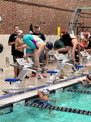 Concord’s Lily Peterson gets set in the blocks before competing in the 100-yard breaststroke at the NHIAA Division I championship at the University of New Hampshire’s Swasey Pool on Feb. 10. Peterson finished second in the event.