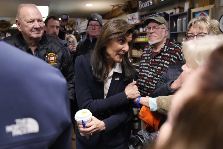 Republican presidential candidate former UN Ambassador Nikki Haley chats with guests while visiting Newfields Country Store during a campaign stop, Friday, Jan. 19, 2024, in Newfields, N.H. (AP Photo/Charles Krupa)