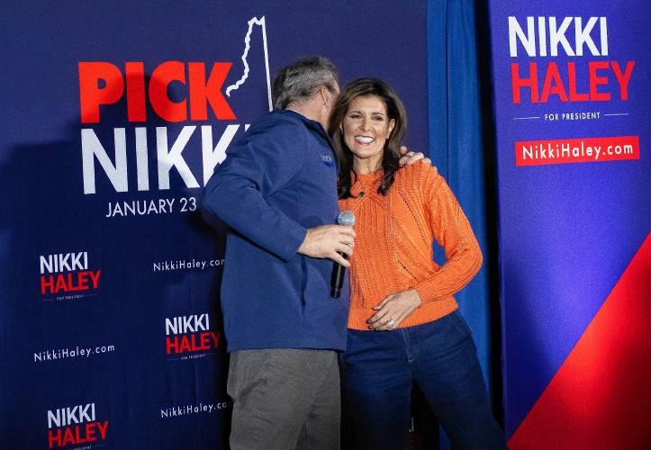 Republican candidate Nikki Haley gets a hug from New Hampshire Governor Chris Sununu as she is introduced at the VFW 1698 in Franklin on Monday morning.