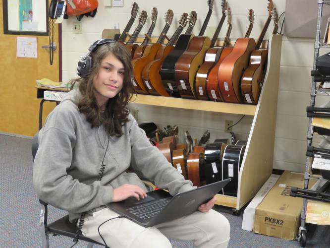  Eighth-grade student Bradley Cooney in the music room at the Henniker Community School. His original composition Outta Time has won the middle school NH Music Educators Association Composition Competition for electronic music. Bradley's work was composed using a Chromebook.