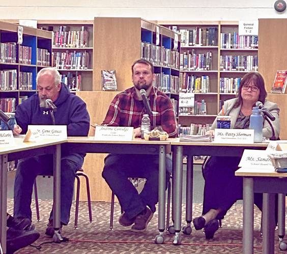 Pembroke School Board chair Andy Camidge (center) and Superintendent Patty Sherman (right) provide updates on cuts to the Pembroke school district Tuesday.