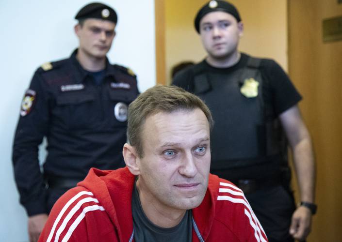 FILE - Russian opposition leader Alexei Navalny speaks to the media prior to a court session in Moscow, on Aug. 22, 2019. Alexei Navalny, the fiercest foe of Russian President Vladimir Putin who crusaded against official corruption and staged massive anti-Kremlin protests, died in prison Friday Feb. 16, 2024 Russia’s prison agency said. He was 47. (AP Photo/Alexander Zemlianichenko, File)