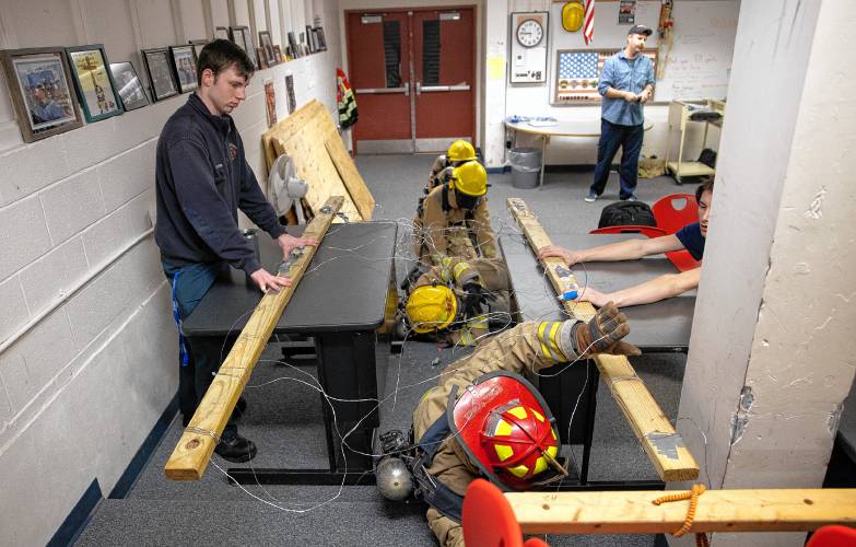 Addison Bergeron, a.k.a. Nails, leads the group through the obstacle course at their CRTC firefighter class at Concord High School on Thursday, March 7, 2024.