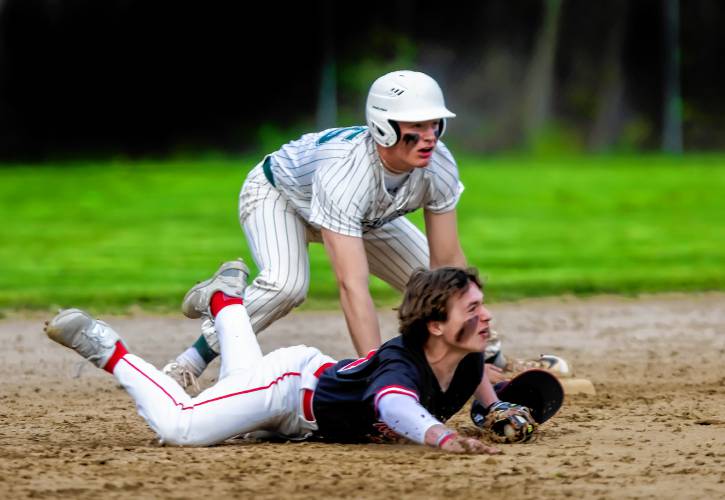 Belmont shortstop Max Ryder gets pushed off second base by Monadnock base runner Ben Dean on a force play on Monday, May 13, 2024. Dean was called out to end the inning.