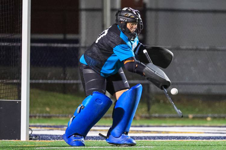 Bow senior goalie Kayla Croscut makes a save against the Hollis-Brookline Cavaliers in the Falcons’ 3-0 semifinal loss.