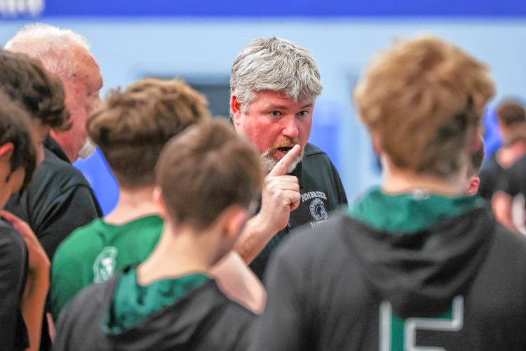 Pembroke boys’ basketball assistant coach Jim Cilley talks to the team during a timeout at the 2024 Division II boys’ basketball semifinals against Hanover at Oyster River High School on March 5.