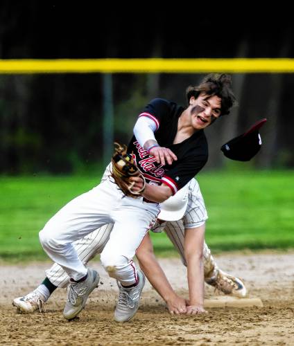 Belmont shortstop Max Ryder gets pushed off second base by Monadnock base runner Ben Dean on a force play on Monday, May 13, 2024. Dean was called out to end the inning.