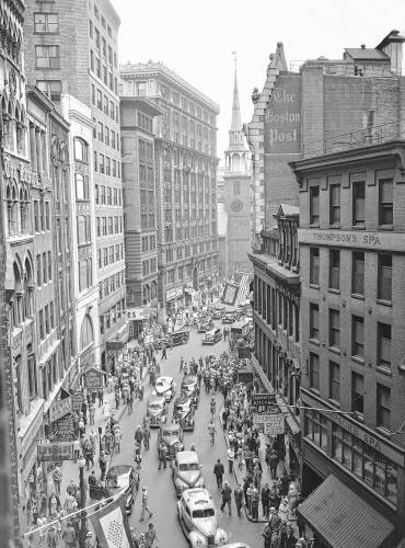 Traffic along Boston’s “Newspaper Row” on Washington Street in the downtown hub section on June 22, 1942. Old South Church is in the background.