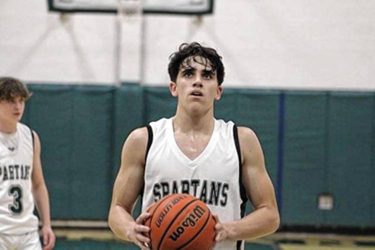 Pembroke Academy guard Joe Fitzgerald prepares to take a free throw during a game at home against Kennett on Friday. Fitzgerald scored 35 points for the Spartans to reach 1,000 in his career in a 77-45 rout over the Eagles.